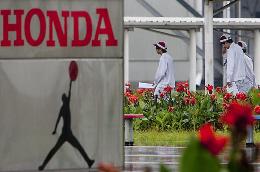 Honda to cut North America production by half